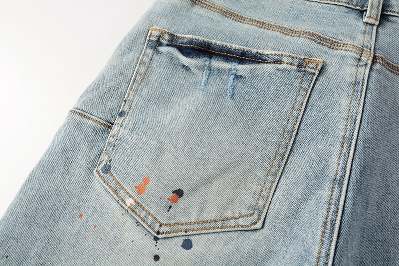 Men Streetwear Denim Shorts Light Blue Wash with Colorful Paint Splashes and Distressed Raw Hem 5071