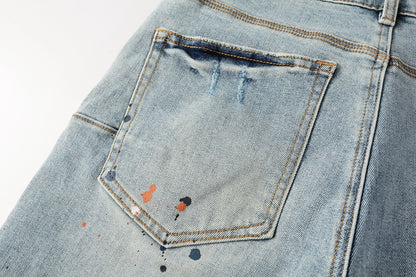 Men Streetwear Denim Shorts Light Blue Wash with Colorful Paint Splashes and Distressed Raw Hem 5071