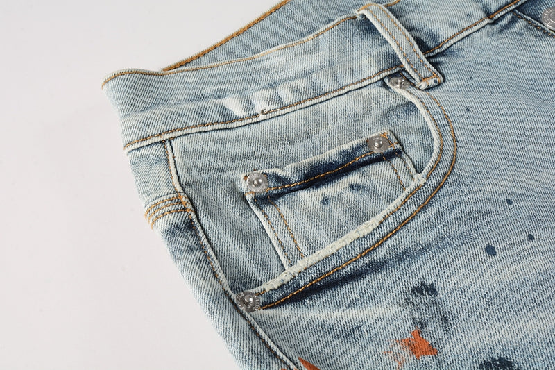 Men Streetwear Denim Shorts Light Blue Wash with Colorful Paint Splashes and Distressed Raw Hem 5071